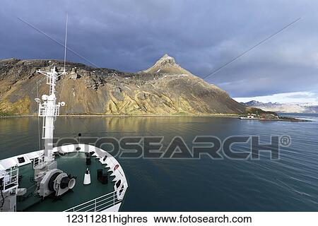 Stock Photograph - Cruise ship in the tranquil harbour of Grytviken; Grytviken, South Georgia, South Georgia and the South Sandwich Islands, United Kingdom. Fotosearch