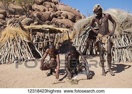 Damara People in traditional clothes are trying to set fire at the The Living Museum of the Damara; Namibia View Large Photo Image Stock Photograph - Damara People in traditional clothes are trying to set fire at the The Living Museum of the Damara; Namibia. Fotosearch