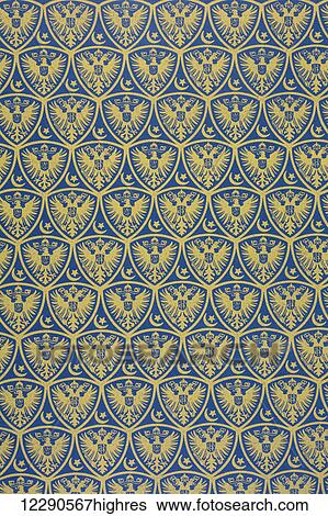 Stock Photograph - Decorative endpapers with the German Coat of Arms. From Illustrierte Geschichte des Weltfrieges1914/15.. Fotosearch