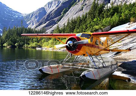 Stock Photograph - DeHavilland Beaver float plane moored at Lake Manzoni, Misty Fjords National Monument Wilderness, Southeast Alaska, summer. Fotosearch