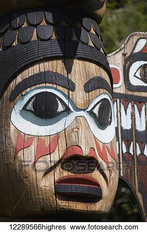 Stock Photograph - Detail of a figure carved into a Totem Pole, Totem Bight State Historical Park, Ketchikan, Southeast Alaska, USA, Spring. Fotosearch
