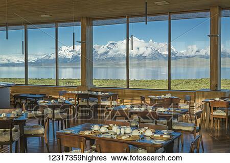 Dining room of Tierra Patagonia Hotel facing Lake Sarmiento and Torres del Paine National Park in Patagonia; Magallanes, Chile View Large Photo Image Stock Photograph - Dining room of Tierra Patagonia Hotel facing Lake Sarmiento and Torres del Paine National Park in Patagonia; Magallanes, Chile. Fotosearch