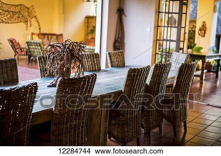 Dining table setting at African resort lodge, Chobe National Park; Kasane, Botswana View Large Photo Image Picture - Dining table setting at African resort lodge, Chobe National Park; Kasane, Botswana. Fotosearch