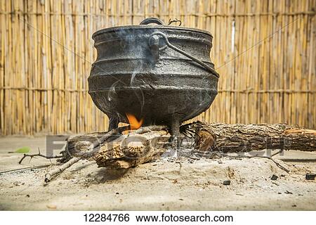 Dinner cooking over a fire, Sexaxa village; Maun, Botswana View Large Photo Image Stock Photograph - Dinner cooking over a fire, Sexaxa village; Maun, Botswana. Fotosearch
