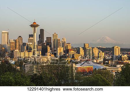 Downtown Seattle in evening light with Mount Rainier in the background; Seattle, Washington, United States of America View Large Photo Image Stock Photograph - Downtown Seattle in evening light with Mount Rainier in the background; Seattle, Washington, United States of America. Fotosearch