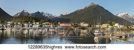 Downtown Sitka on a clear summer evening; Sitka harbor and docked fishing boats in the foreground with the Sisters Mountains in the background, Southeast Alaska, USA, Summer View Large Photo Image Stock Photograph - Downtown Sitka on a clear summer evening; Sitka harbor and docked fishing boats in the foreground with the Sisters Mountains in the background, Southeast Alaska, USA, Summer. Fotosearch