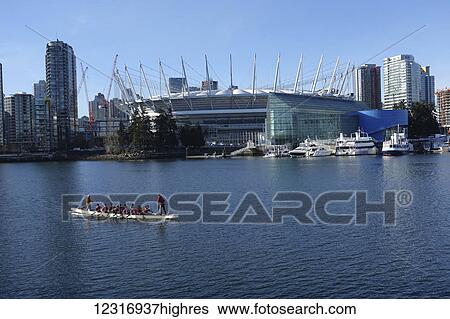 Stock Photograph - Dragon boat in front of BC Place; Vancouver, British Columbia, Canada. Fotosearch