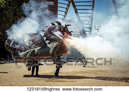 Stock Photograph - Dragon from 0u Barris district during Saint George's festivities; Barcelona, Catalonia, Spain. Fotosearch