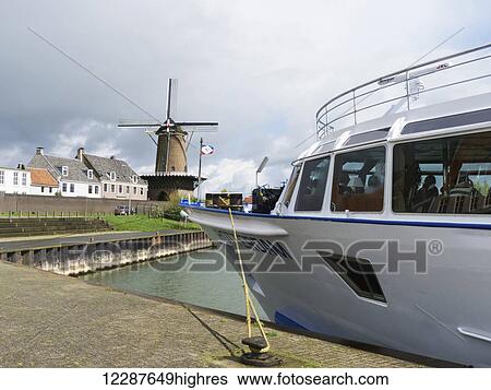 Drive-through windmill, seen from a river-cruiser; Wijk bij Duurstede, Holland View Large Photo Image Stock Photograph - Drive-through windmill, seen from a river-cruiser; Wijk bij Duurstede, Holland. Fotosearch