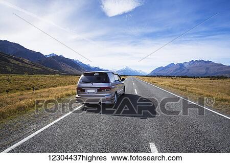 Stock Photograph - Driving into Mount Cook National Park; Mount Cook, Canterbury, New Zealand. Fotosearch