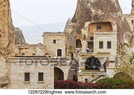 Stock Photograph - Dwellings and fairy chimneys: Goreme, Cappadocia, Turkey. Fotosearch
