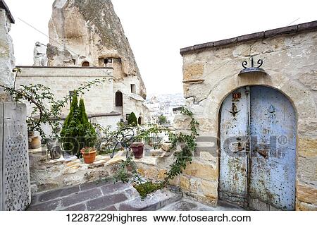 Stock Photograph - Dwellings and fairy chimneys: Goreme, Cappadocia, Turkey. Fotosearch