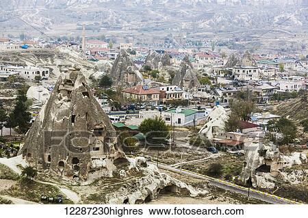 Stock Photograph - Dwellings and fairy chimneys: Goreme, Cappadocia, Turkey. Fotosearch