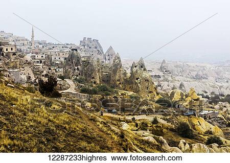 Stock Photograph - Dwellings and fairy chimneys: Goreme, Cappadocia, Turkey. Fotosearch