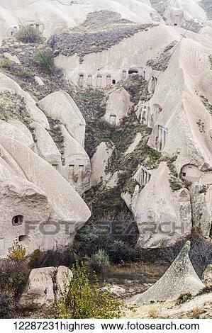 Stock Photograph - Dwellings in fairy chimneys: Goreme, Cappadocia, Turkey. Fotosearch