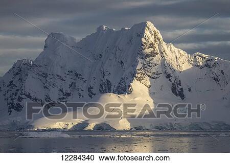 Evening light on Lemaire Island in Paradise Harbor, Antarctic Peninsula; Antarctica View Large Photo Image Stock Image - Evening light on Lemaire Island in Paradise Harbor, Antarctic Peninsula; Antarctica. Fotosearch