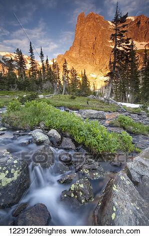 First light on Long's Peak at Chasm Lake in Rocky Mountain National Park; Colorado, United States of America View Large Photo Image Stock Photograph - First light on Long's Peak at Chasm Lake in Rocky Mountain National Park; Colorado, United States of America. Fotosearch