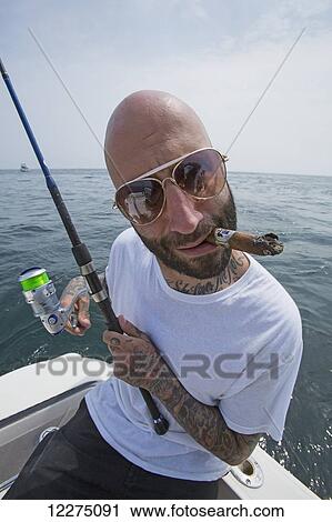 Fisherman with a cigar in his mouth, Boston harbour; Boston, Massachusetts, United States of America View Large Photo Image Stock Image - Fisherman with a cigar in his mouth, Boston harbour; Boston, Massachusetts, United States of America. Fotosearch