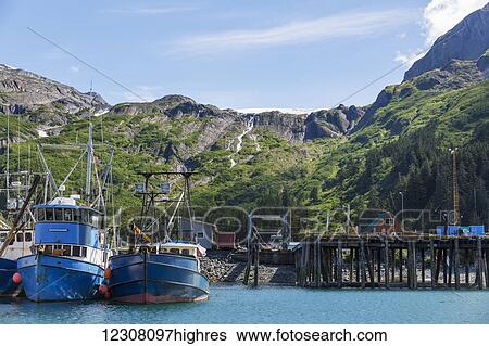 Fishing Boats docked at the Passage Canal Harbor in Prince William Sound, clear Sunny skies overhead, Whittier, South Central Alaska, USA, Summer View Large Photo Image Stock Photograph - Fishing Boats docked at the Passage Canal Harbor in Prince William Sound, clear Sunny skies overhead, Whittier, South Central Alaska, USA, Summer. Fotosearch