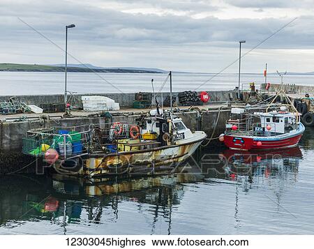 Fishing boats moored in the tranquil harbour; John O'Groats, Scotland View Large Photo Image Stock Photograph - Fishing boats moored in the tranquil harbour; John O'Groats, Scotland. Fotosearch