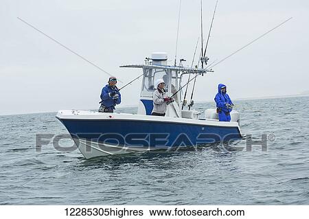 Stock Photograph - Fishing for stripers off the Atlantic coast; Cape Cod, Massachusetts, United States of America. Fotosearch