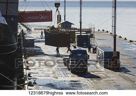 Freighters unload at dock; Ushuaia, Magallanes and Antartica Chilena, Argentina View Large Photo Image Stock Photograph - Freighters unload at dock; Ushuaia, Magallanes and Antartica Chilena, Argentina. Fotosearch