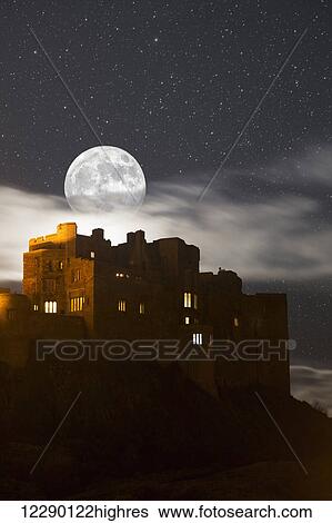Full moon glowing in a starry sky over illuminated buildings; Bamburgh, Northumberland, England View Large Photo Image Stock Photograph - Full moon glowing in a starry sky over illuminated buildings; Bamburgh, Northumberland, England. Fotosearch