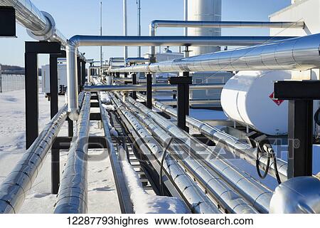 Stock Photograph - Gas pipelines in the winter snow; Morinville, Alberta, Canada. Fotosearch