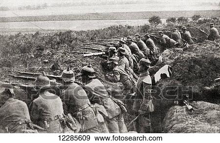 Stock Photo - German troops firing from trenches under the direction of an officer during WWI. From The War Illustrated Album Deluxe, published 1915.. Fotosearch