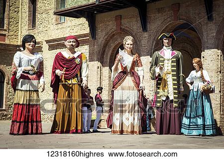 Stock Photograph - Giants from 0u Barris district during Saint George's Day festivities; Barcelona, Catalonia, Spain. Fotosearch