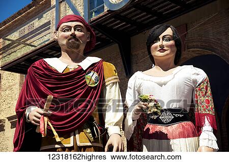 Stock Photograph - Giants from 0u Barris district during Saint George's Day festivities; Barcelona, Catalonia, Spain. Fotosearch