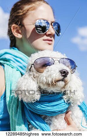 Girl and her dog wearing matching sunglasses; Balsam Lake, Ontario, Canada View Large Photo Image Stock Photograph - Girl and her dog wearing matching sunglasses; Balsam Lake, Ontario, Canada. Fotosearch