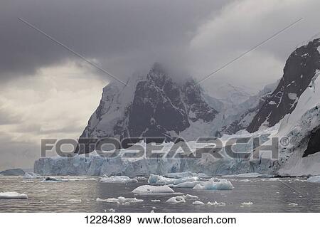 Stock Photo - Glacier calving into Neko Harbor, Antarctic Peninsula; Antarctica. Fotosearch