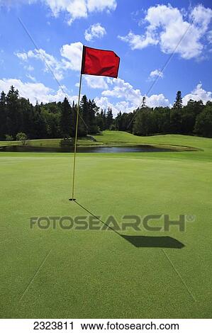Golf course green with red flag in hole; Hecla Island, Manitoba, Canada View Large Photo Image Stock Image - Golf course green with red flag in hole; Hecla Island, Manitoba, Canada. Fotosearch