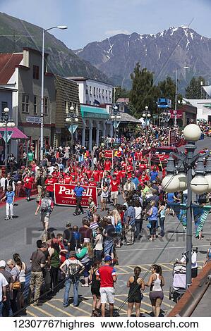 Stock Photograph - Governor Sean Parnell and his wife Sandy lead a group of Parnell supporters in a parade preceeding the annual Mt. Marathon race. 4th of July, 2014 in Seward, Southcentral Alaska. Summer.. Fotosearch