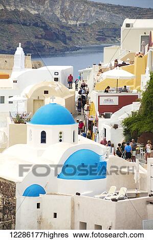 Greek orthodox church with blue dome in the village of Oia; Oia, Santorini, Greece View Large Photo Image Stock Photograph - Greek orthodox church with blue dome in the village of Oia; Oia, Santorini, Greece. Fotosearch