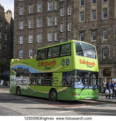 Stock Photograph - Green Edinburgh tour bus; Edinburgh, Scotland. Fotosearch