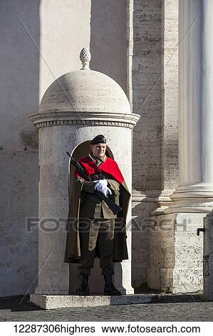 Stock Photograph - Guard at Quirinal Palace, the president's home; Rome, Italy. Fotosearch