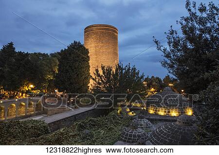 Stock Photograph - Hajji Gayyib bathhouse and Maiden Tower at night; Baku, Azerbaijan. Fotosearch