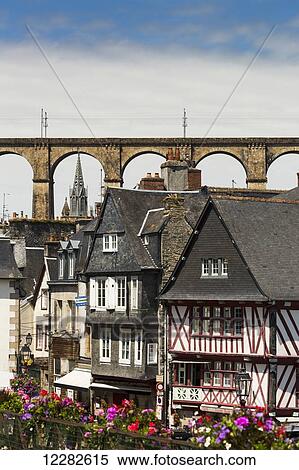 Half timbered old buildings with large stone viaduct and church steeple in the background with flowers in the foreground; Morlaix, Brittany, France View Large Photo Image Stock Photography - Half timbered old buildings with large stone viaduct and church steeple in the background with flowers in the foreground; Morlaix, Brittany, France. Fotosearch