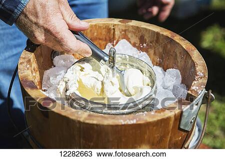 Hands scooping ice cream out of old-fashioned ice cream maker; Maryland, United States of America View Large Photo Image Stock Image - Hands scooping ice cream out of old-fashioned ice cream maker; Maryland, United States of America. Fotosearch