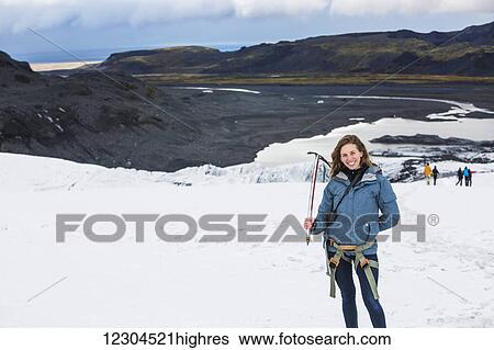 Stock Photograph - Hiking through the Solheimajokull glacier; Solheimajokull, Iceland. Fotosearch