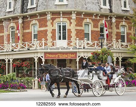 Stock Photography - Horse-drawn carriage in front of Prince of Wales Hotel; Niagara-on-the-Lake, Ontario, Canada. Fotosearch