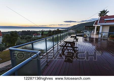 House with a view of the shoreline of the Sea of Galilee; Migdal, Israel View Large Photo Image Stock Photograph - House with a view of the shoreline of the Sea of Galilee; Migdal, Israel. Fotosearch