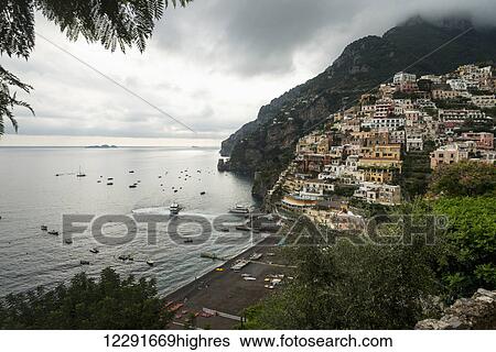 Houses on the hillside and boats in the water along the Amalfi coast; Positano, Campania, Italy View Large Photo Image Stock Photograph - Houses on the hillside and boats in the water along the Amalfi coast; Positano, Campania, Italy. Fotosearch