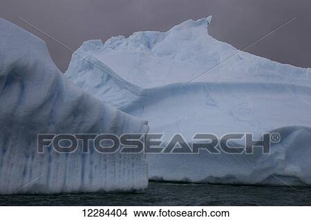 Iceberg graveyard behind Pleneau Island near Lemaire Channel; Antarctica View Large Photo Image Picture - Iceberg graveyard behind Pleneau Island near Lemaire Channel; Antarctica. Fotosearch