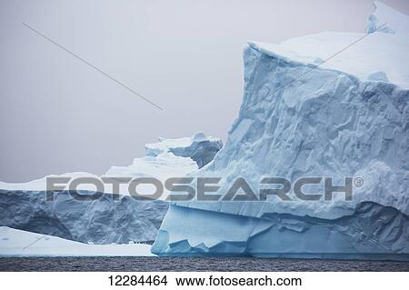 Iceberg graveyard behind Pleneau Island near Lemaire Channel; Antarctica View Large Photo Image Picture - Iceberg graveyard behind Pleneau Island near Lemaire Channel; Antarctica. Fotosearch