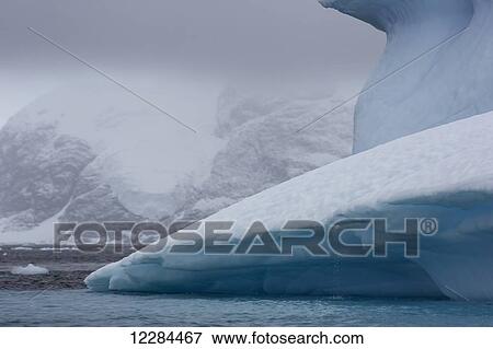 Iceberg graveyard behind Pleneau Island near Lemaire Channel; Antarctica View Large Photo Image Stock Photo - Iceberg graveyard behind Pleneau Island near Lemaire Channel; Antarctica. Fotosearch