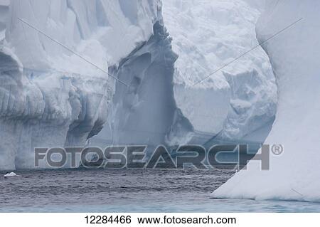 Iceberg graveyard behind Pleneau Island near Lemaire Channel; Antarctica View Large Photo Image Stock Photograph - Iceberg graveyard behind Pleneau Island near Lemaire Channel; Antarctica. Fotosearch