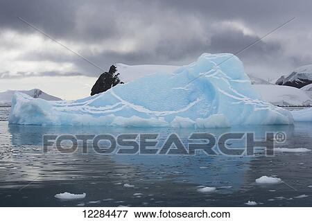Iceberg in Paradise Harbor, Antarctic Peninsula; Antarctica View Large Photo Image Stock Photo - Iceberg in Paradise Harbor, Antarctic Peninsula; Antarctica. Fotosearch
